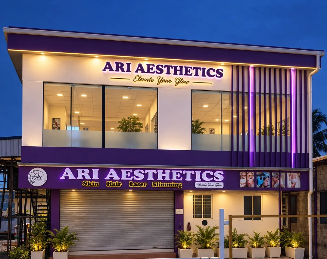 The Ari Aesthetics clinic building in Perumbakkam, Chennai, with its signs lit at dusk
